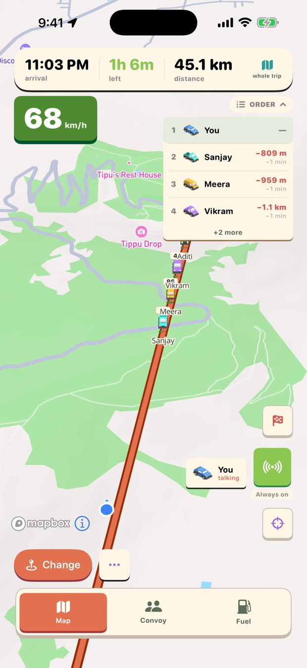 The map with the walkie-talkie live: the transmit button is on and a 'You — talking' chip sits over the convoy.